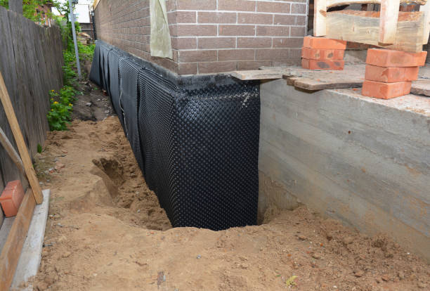 SJ Waterproofing Pros technician performing targeted Emergency Waterproofing assessment in Marlboro, NY